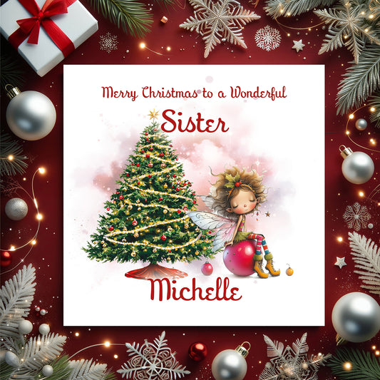 Christmas card with a fairy by a decorated tree, surrounded by festive decorations on a red background.