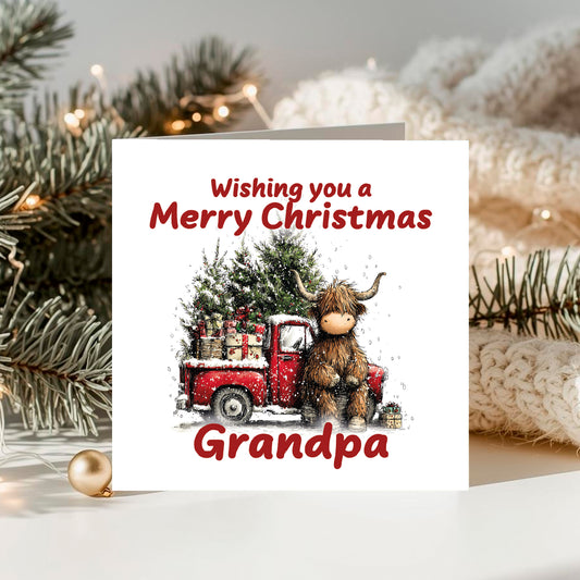 Christmas card with a red truck and Highland cow, featuring 'Wishing you a Merry Christmas Grandpa' text, surrounded by festive decorations.