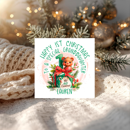 Christmas card  for 1st birthday with a teddy bear ,present and number one  personalised for granddaughter Lauren