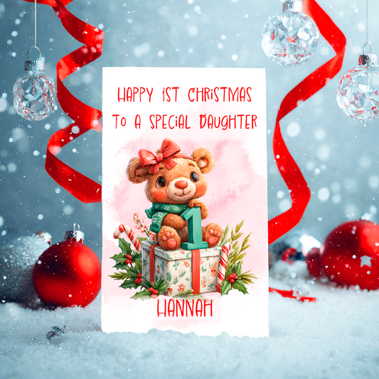 Christmas card with a teddy bear, a number 1 and gift box, surrounded by festive decorations.
Details