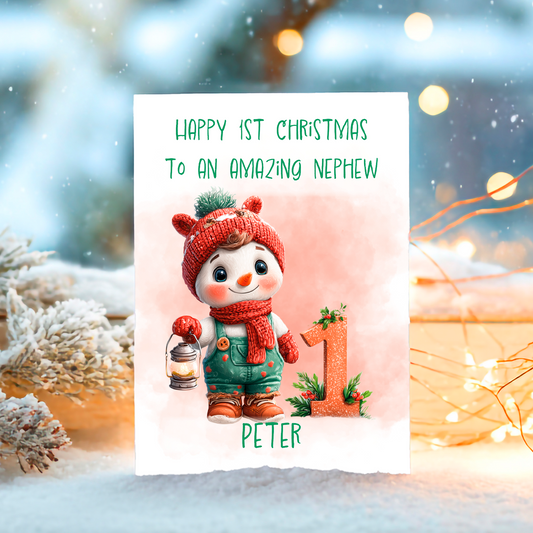 Christmas card with a snowman and text 'Happy 1st Christmas to an amazing nephew' on a snowy background.