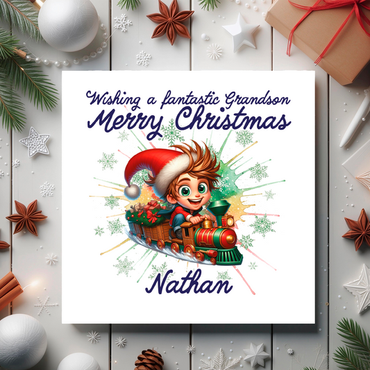 Christmas card with a child on a train, surrounded by festive decorations on a wooden surface.