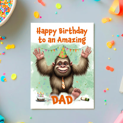 Birthday card with cartoon monkey wearing a party hat and tie, surrounded by confetti and streamers.