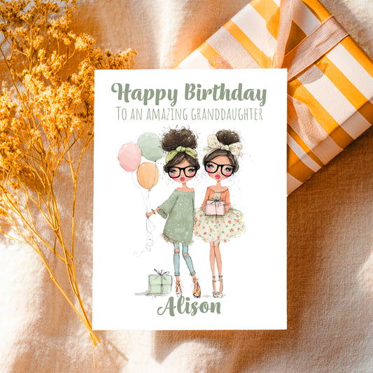 Birthday card for an amazing granddaughter with illustrations of two girls, balloons, and a gift, placed on a textured surface with decorative elements.