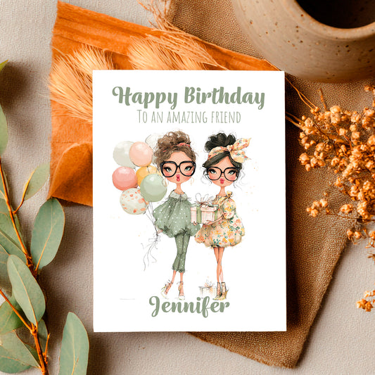 Birthday card with illustration of two women, balloons, and a gift, placed on a decorative surface with a cup and leaves.
