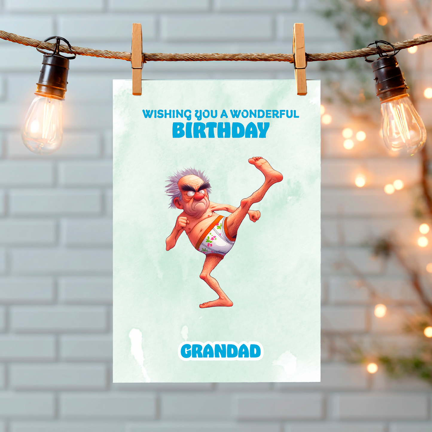 Birthday card with cartoon character hanging on a string with lights in the background. Can Be personalised for any male relation or a friend