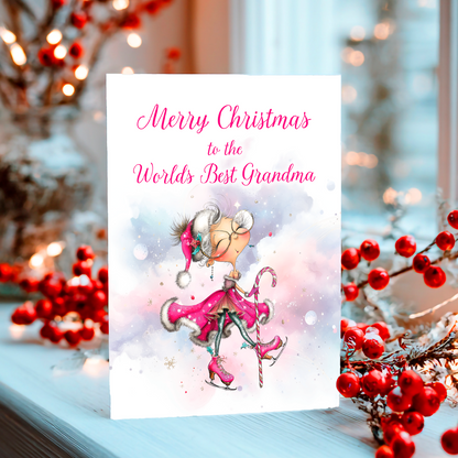 Christmas card with a fairy and text 'Merry Christmas to the Worlds Best Grandma' surrounded by red berries and lights.