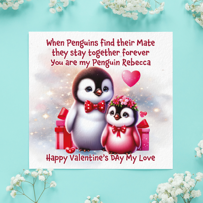 Valentine's Day card with penguins and romantic text on a light blue background with white flowers.