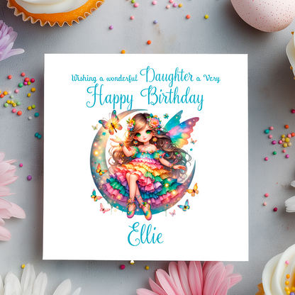 Birthday card with a colorful fairy design on a decorative background with flowers and candies.