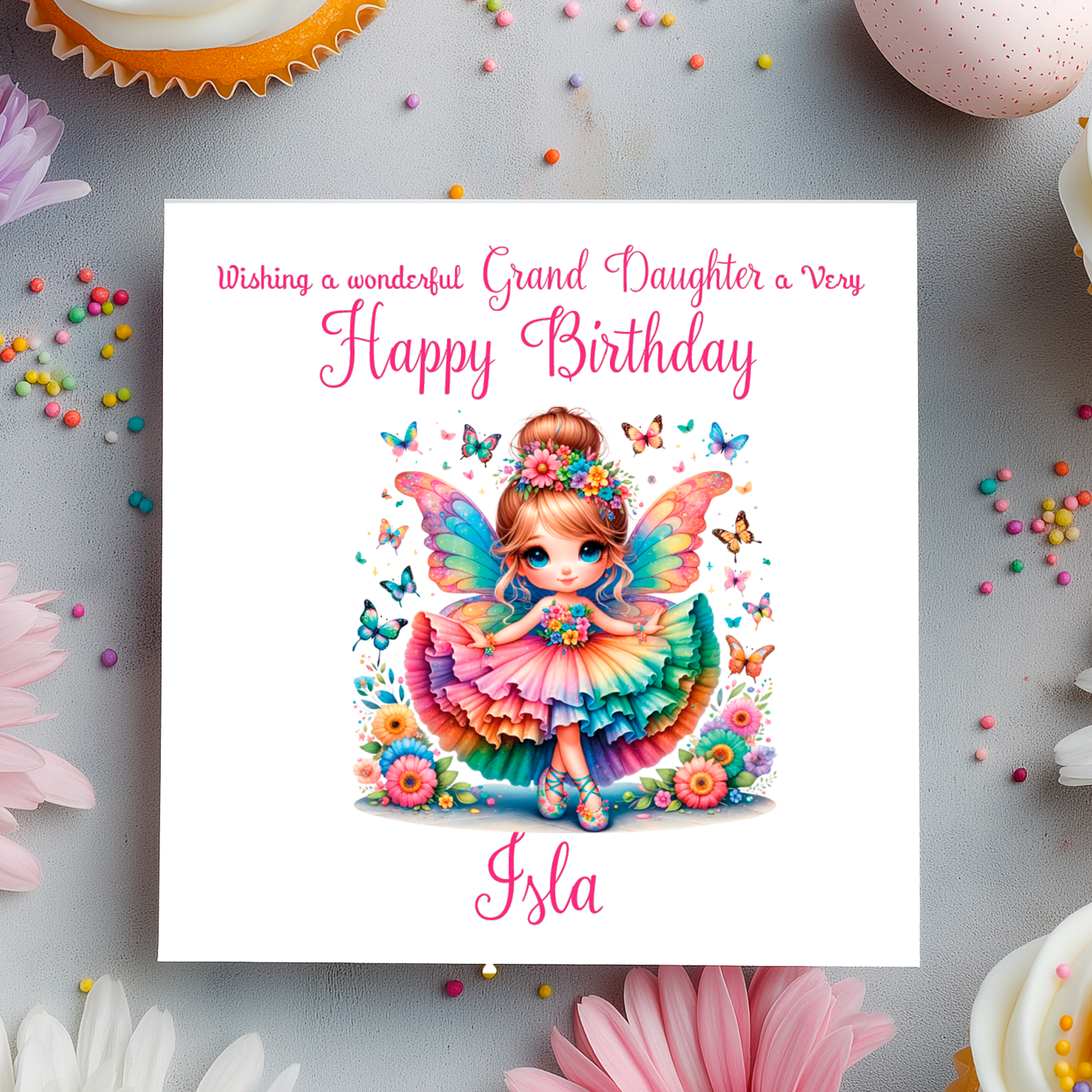 Birthday card with a colorful fairy illustration and decorative elements on a gray background.