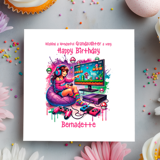 birthday card with cartoon illustration of girl sat on been bag playing retro game. Birthday wishes text and personalised name and relation