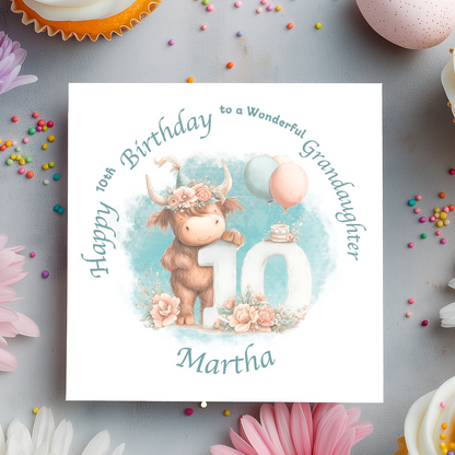 10th Birthday card with a cartoon cow holding a number 10, surrounded by flowers and balloons on a light blue background. Personalised for name, age and relation.