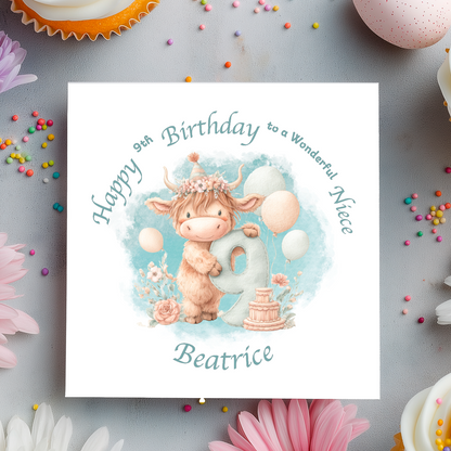 9th Birthday card with a cartoon cow holding a number 9, surrounded by flowers and balloons on a light blue background. Personalised for name, age and relation.