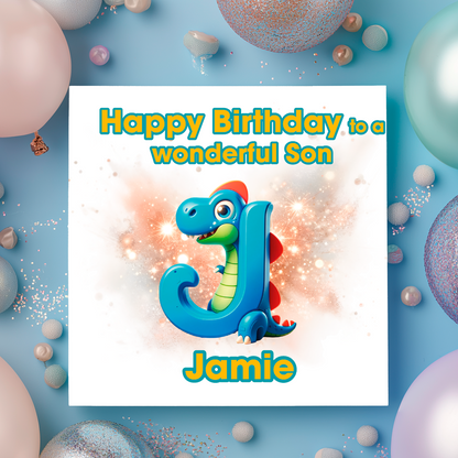 Birthday card with a blue dragon holding the letter J, surrounded by colorful balloons on a light blue background. Can be personalised for name, age and relation