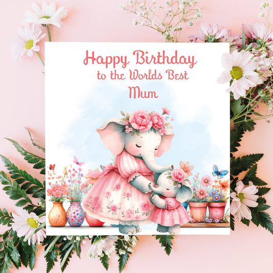 Greeting card with two elephants in a floral setting and text 'Happy Birthday to the Worlds Best Mummy' on a pink background.