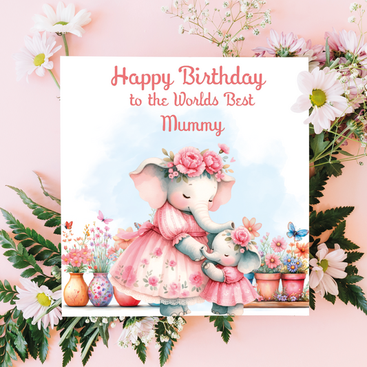 Greeting card with two elephants in a floral setting and text 'Happy Birthday to the Worlds Best Mummy' on a pink background.