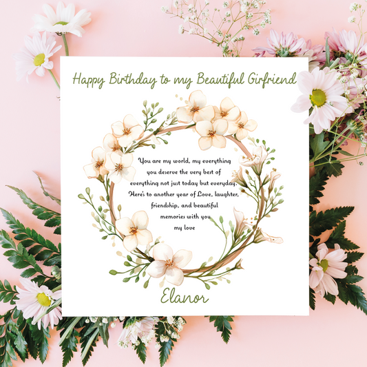 Greeting card with floral design and birthday message for a girlfriend on a pink floral background