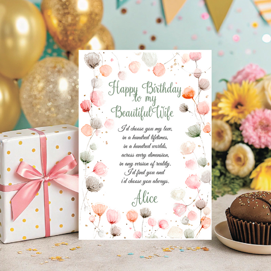 Greeting card for a wife's birthday with flowers, gift, and cupcake on a decorative background