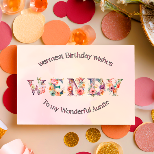 A Birthday Card containing   letters made of colourful flowers  that spells out  aName .   with birthday text personalised for relation and name