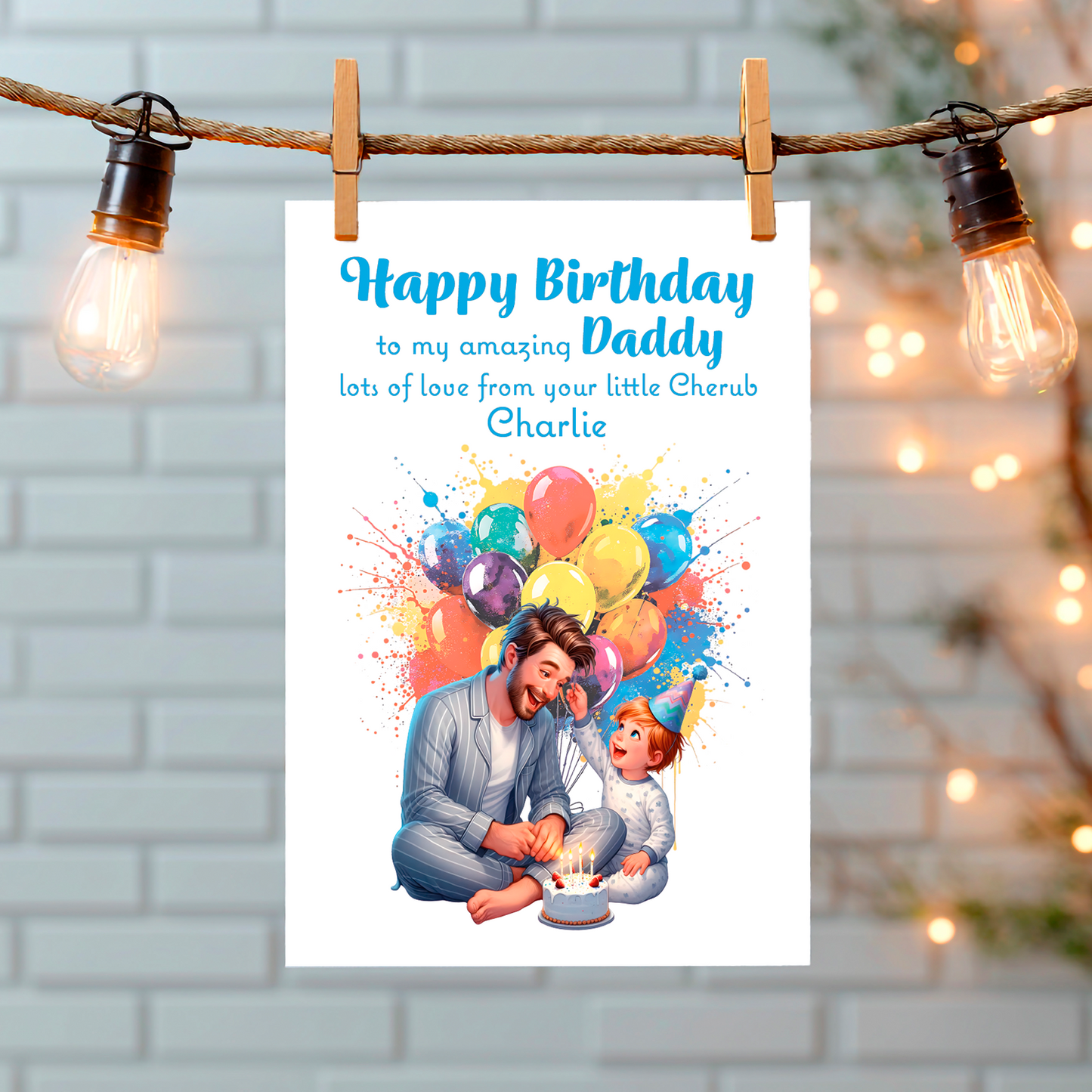 A Birthday card with an illustration of a young Boy  and his Dad with a birthday cake and balloons  and a personalised message that can be personalised for Dad,Daddy,Step Daddy or Step Dad. hanging from a string of lights on a white wall background 