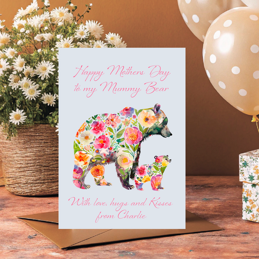 Greeting card with floral bear design on a wooden surface with flowers and balloons. Can be personalised for Mum, Mummy, Step Mum,Step Mummy,Grandma or Nanna and child/childrens names added