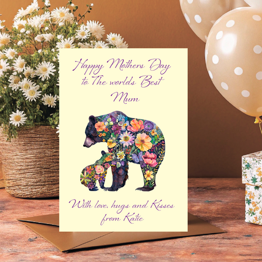 Greeting card with floral bear design and flowers, balloons, and gift box on a wooden surface. Can be personalised for Mum, Mummy, Step Mum,Step Mummy , Grandma or Nanna and child/childrens names added