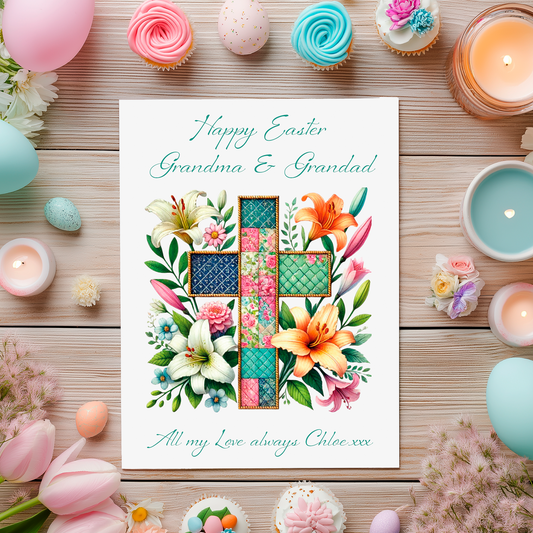 Easter card with floral design and  patchwork cross and a personalised message on a wooden table with Easter decorations. Can be personalised with name and relation