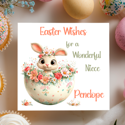 Easter card with a bunny in a floral egg and text 'Easter Wishes for a Wonderful Niece Penelope' on a decorative background. Can be personalised with name and relation 