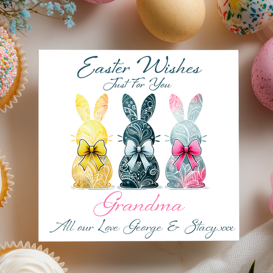 Easter card with decorative bunnies and personalised text on a blurred Easter-themed background. Can be personalised with name, relation and name of sender. 