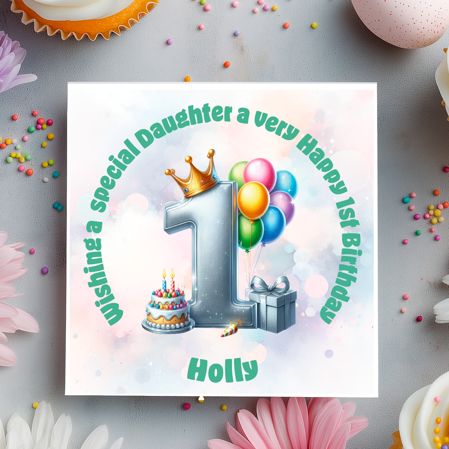1st Birthday card with a number 1,colorful balloons, cake, and crown on a decorative background with flowers and candies.