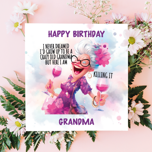 Birthday card with cartoon grandma holding a glass of wine, surrounded by flowers on a pink background.